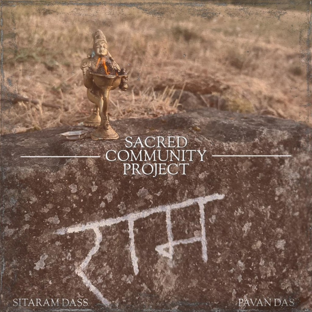 Album cover with the title, "Sacred Community Project," and listed artists as, "Sitaram Dass" and "Pavan Das. It is a picture of a rock with the word, "Ram," written on it in sanskrit.